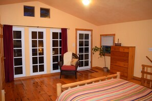 Bedroom with door to hidden deck in the trees