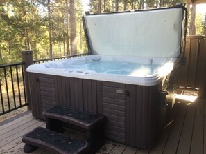 Large 8 ft hot tub on the back deck