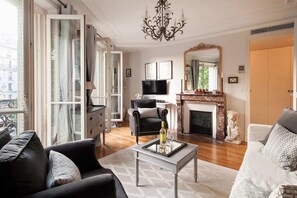 Living room is ultra-charming and truly Parisian.