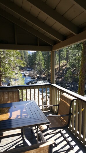 Outdoor dining area on upper covered deck