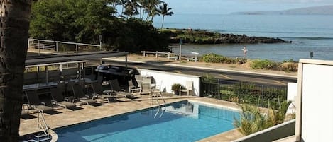 View of pool and ocean from rear lanai