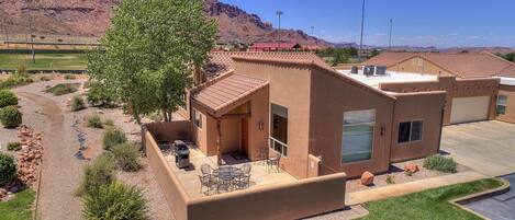 Large patio with Weber gas grill and outdoor furniture