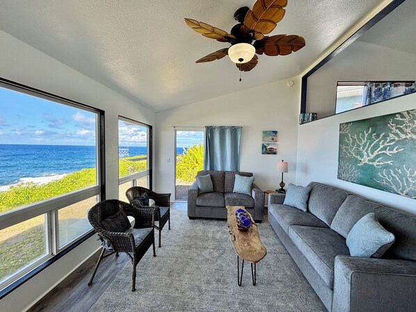Living room with panoramic views of the ocean.