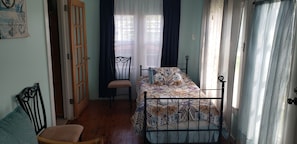 Twin bed in front sun room