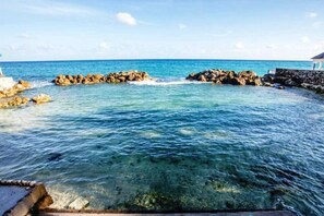 Another view of our sheltered private beach. Beyond the opening is deeper water.