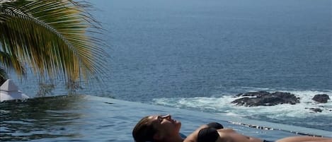 Upper infinity pool off livingroom with views of Pacific Ocean