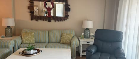 living room- recliner, sofa bed, smart TV