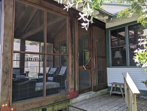 Walk in through the screened in porch that seats 7.  