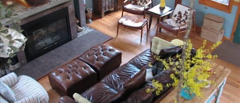 View of Great room from the loft.  Fireplace  and oversized leather couch.