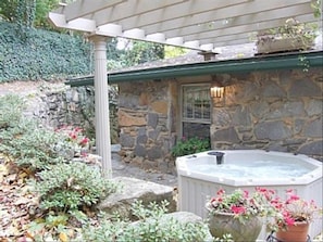 HOT TUB on Flagstone Patio w/ Pergola above the Flower Pots, Boulders & Azaleas.