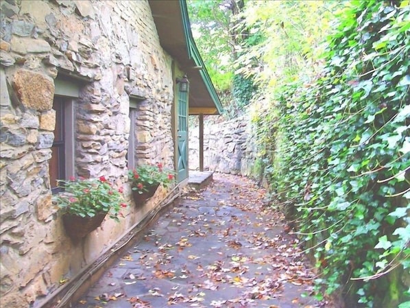 A MAGICAL RETREAT with Old World Charm and Leafy Views of Nearby Mountains.