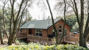 A wrap around deck provides comfortable seating and BBQ with forest views. 