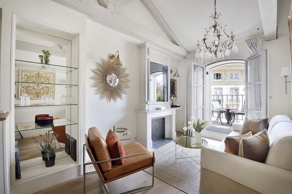 The large French window lets in lots of natural light at the beautiful Monbazillac apartment.