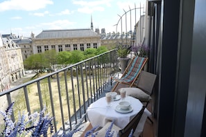 Enjoy your private balcony overlooking the lovely Place Dauphine.