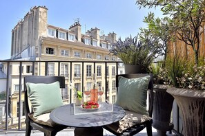 Enjoy your private balcony overlooking the lovely Place Dauphine.