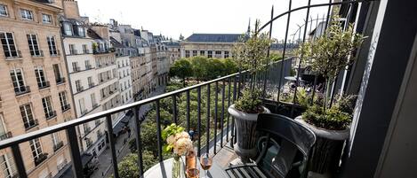 Enjoy your private balcony overlooking the lovely Place Dauphine.