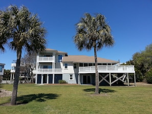 View of house from back yard. Deck has great view of ocean.