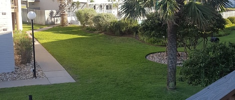 View of pool and ground from balcony