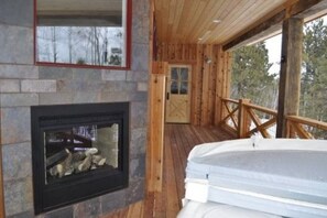 Relax out on the deck in the hot tub next to the see-thru fireplace.