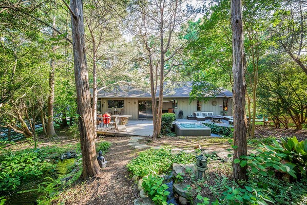 A view of the deck from the backyard...You couldn't ask for a more tranquil and private setting to enjoy a soak in the hot tub or chilling out on the deck. All this and so close to Uptown and the other Charlotte hot spots!
