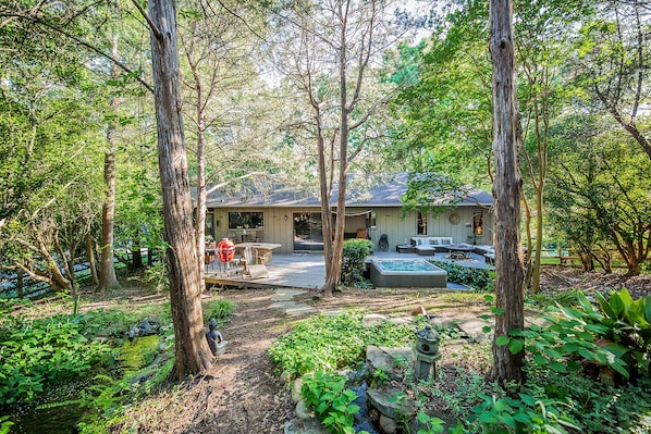 A view of the deck from the backyard...You couldn't ask for a more tranquil and private setting to enjoy a soak in the hot tub or chilling out on the deck. All this and so close to Uptown and the other Charlotte hot spots!