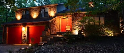 The front of The Zen Retreat...at night...there is landscape lighting surrounding the house.