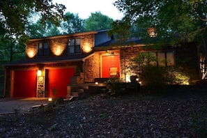The front of The Zen Retreat...at night...there is landscape lighting surrounding the house.