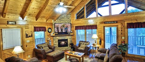 Large open concept living room with 60" tv.