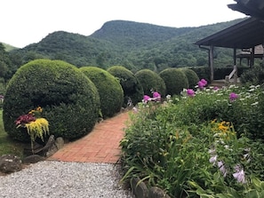 Gardens, flowers, and lush landscaping is abundant.