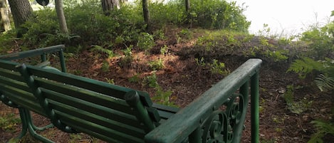 Relax in the glider by the shore of Guthrie Lake