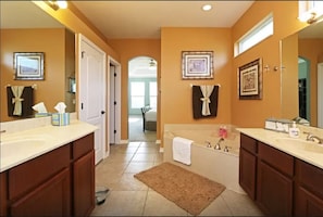 Master bath includes large walk in shower, huge soaking tub, private toilet area