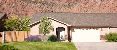 Front of the house with the Moab Rim behind