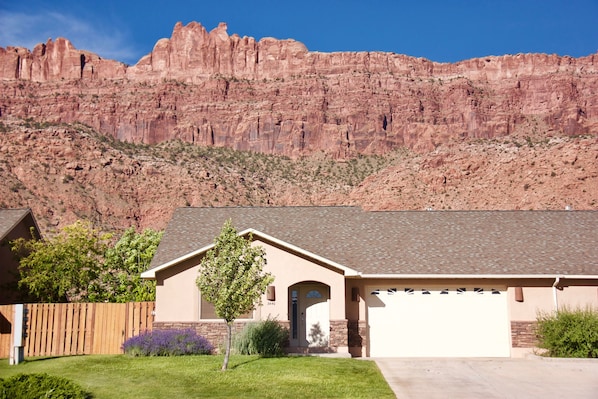 Front of the house with the Moab Rim behind