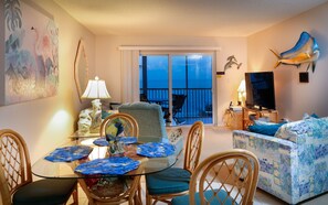 living room/dining area with access to the balcony overlooking the ocean