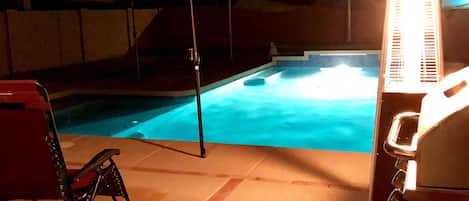 Lovely saltwater pool at night with the gas flame heater.