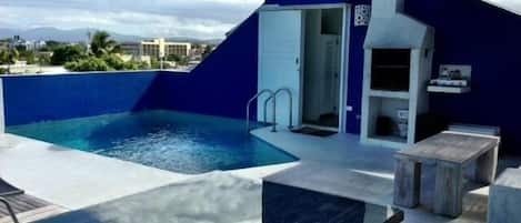 Top roof pool, with chill out area and BBQ overseeing the ocean