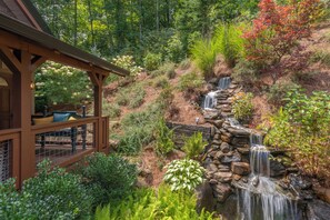 Gorgeous landscaping with calming water feature.