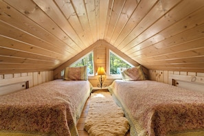 Loft space has two twin beds