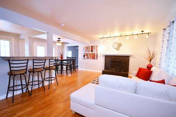 Living room with new furnishings: artwork, furniture, lights, etc.