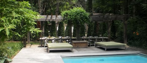 Pool, pergola, and outdoor dining table 