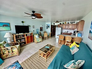 Living area with view to dining area & kitchen