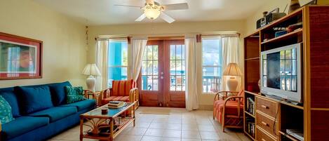 Beautiful condo with porch facing the pool with the sea beyond!