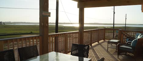 Bottom deck with amazing views, a table for a family dinner outside