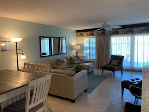 Spacio9us living area op-ens to kitchen as well as patio.