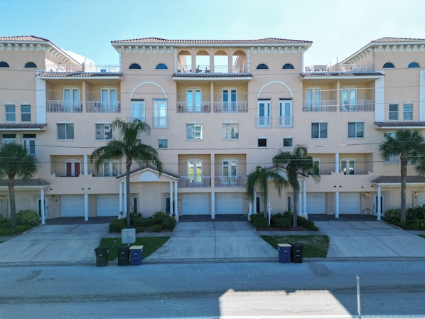 Townhouse is the middle unit with partially covered private rooftop terrace
