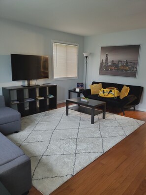 living room w/ futon couch/bed