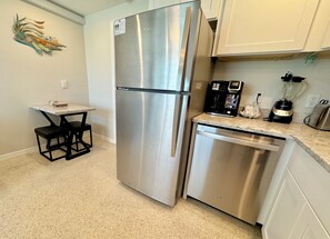 Bistro quartz top table conveniently just off the full kitchen