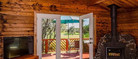 French doors leading to large deck and golf course views