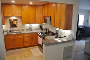 Kitchen complete with all amenities and updated stainless steel appliances! (inc