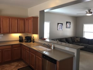 Kitchen sink into living room view